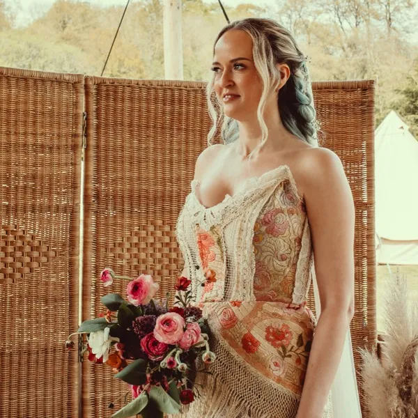 A bride holding her bouquet before the ceremony