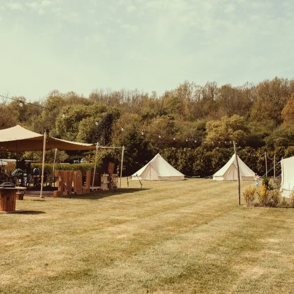 The grounds with the stretch tent, bell tents and giant LOVE letters